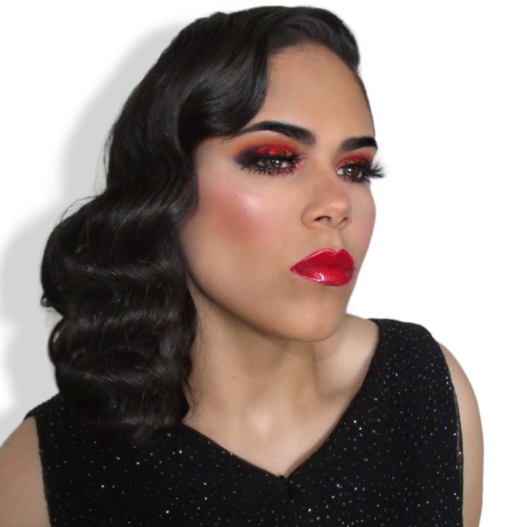 Pale woman with glossy red lipstick and red glitter eyeshadow